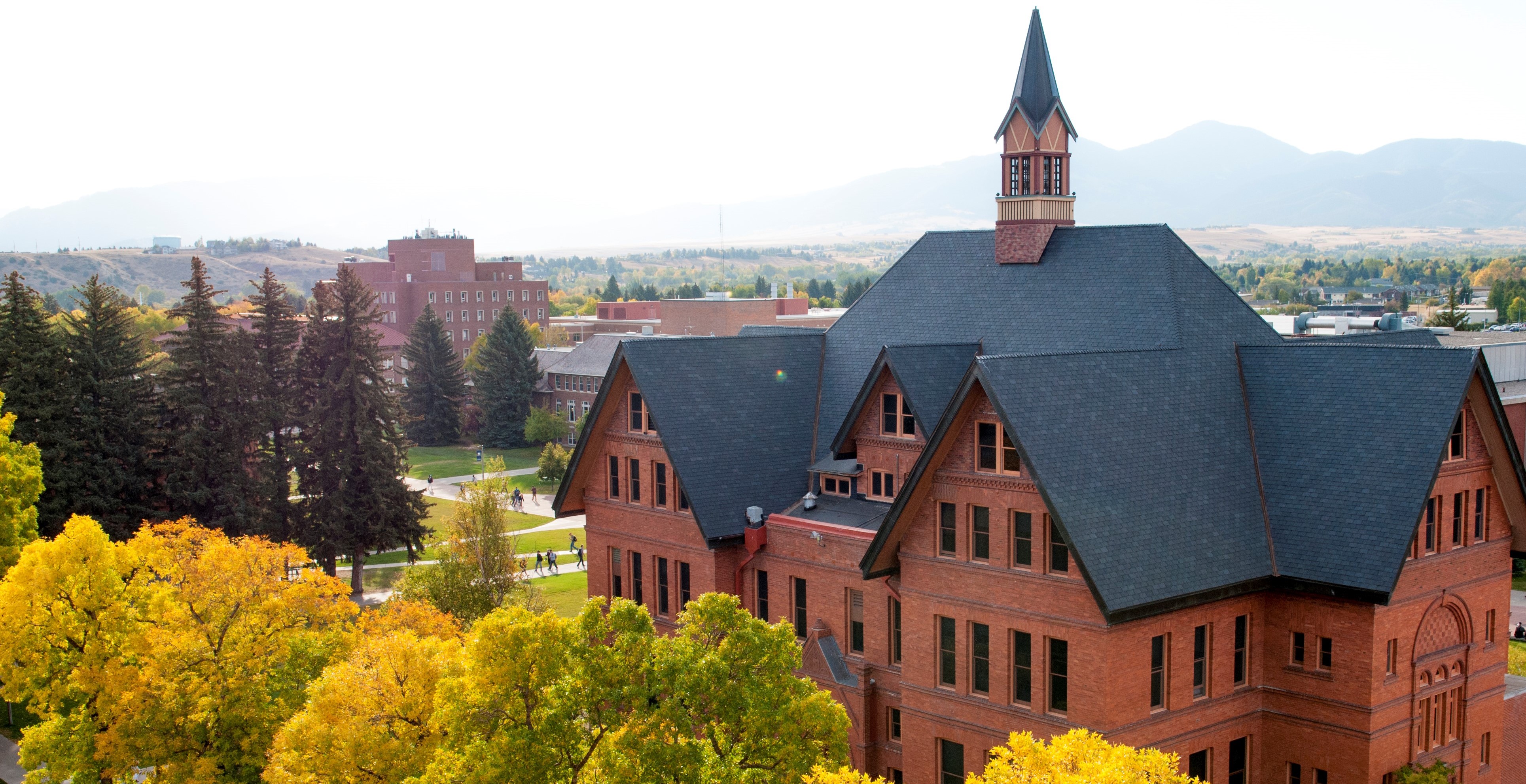 Montana Hall and campus from the air in summer.