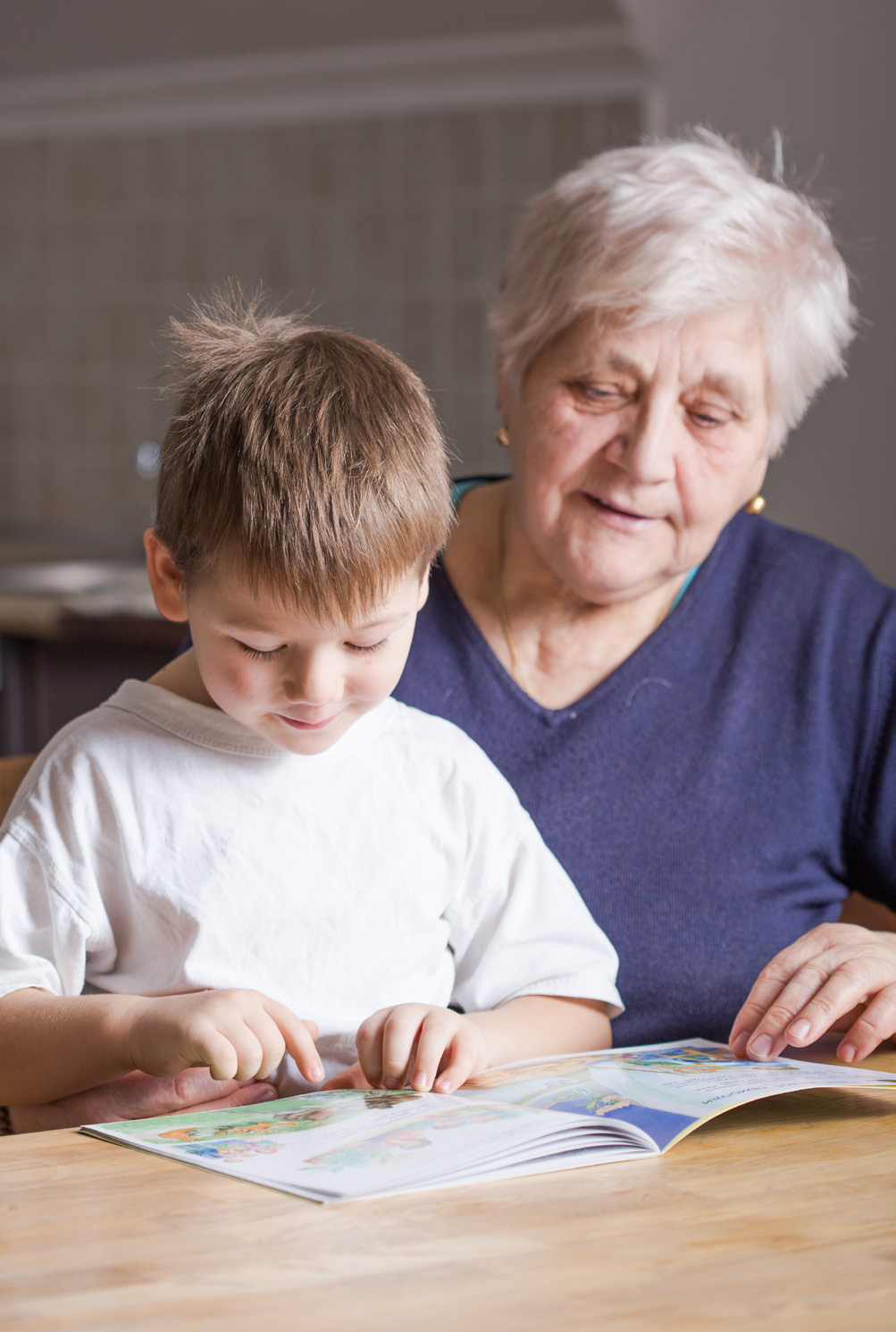 Grandma reading book to grandson