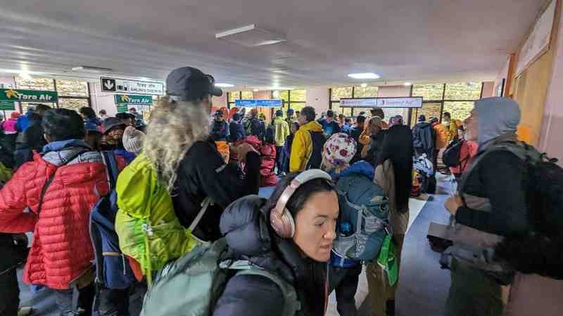 The remaining travelers wait to board their flight.