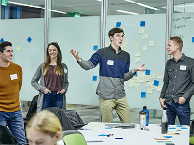 Four students presenting in a Business class